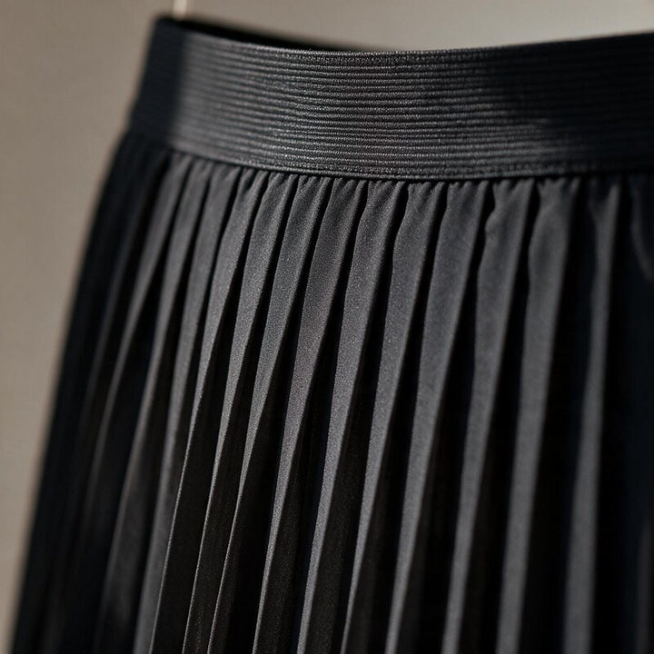 Ponsonby Lane pleated midi skirt in Black – close-up detail of waistband and pleats